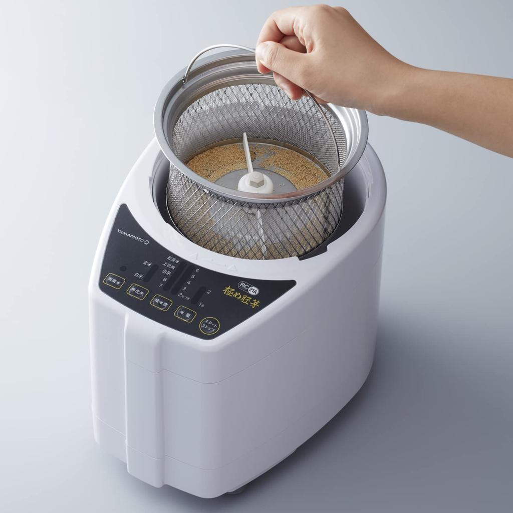 Электрическая домашняя шлифовальная машина для риса Yamamoto Ultimate Germ White разделяет рис на белую крупу и отруби, а модель YE-RC21A-WH шлифует рис и зародыши.