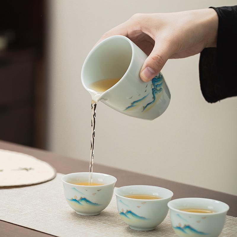 Qianli Jiangshan suet jade white porcelain kung fu tea set, household light luxury high-end ceramic cover bowl tea cup set