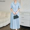 Женский летний костюм из двух предметов: блузка с коротким рукавом и юбка миди