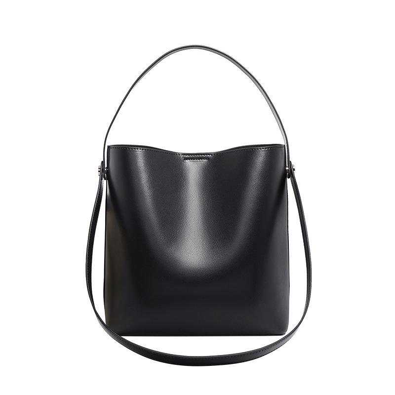 Новая кожаная модная нишевая дизайнерская сумочка, коровья кожа, большая вместимость, сумка-ведро через плечо для通勤