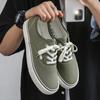 "Douchuan 2025 Весна/Осень Модные низкие парусиновые кроссовки для мужчин: Универсальная повседневная обувь для пар и студентов.
