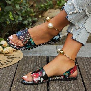 European and American one-word buckle flat sandals women's new open-toed simple pearl metal buckle cool slippers