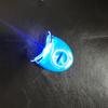 Qiao Qiang Mini Whitening Tooth Lamp: Portable Cold Light Device with Gel for Teeth Whitening, In White or Blue.