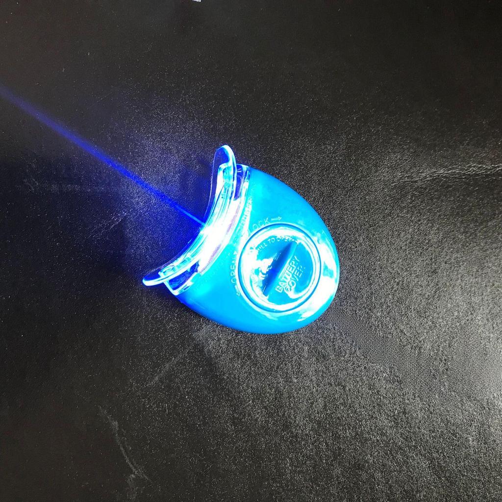 Qiao Qiang Mini Whitening Tooth Lamp: Portable Cold Light Device with Gel for Teeth Whitening, In White or Blue.
