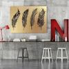 Feeby Canvas print, Gold four drawn feathers