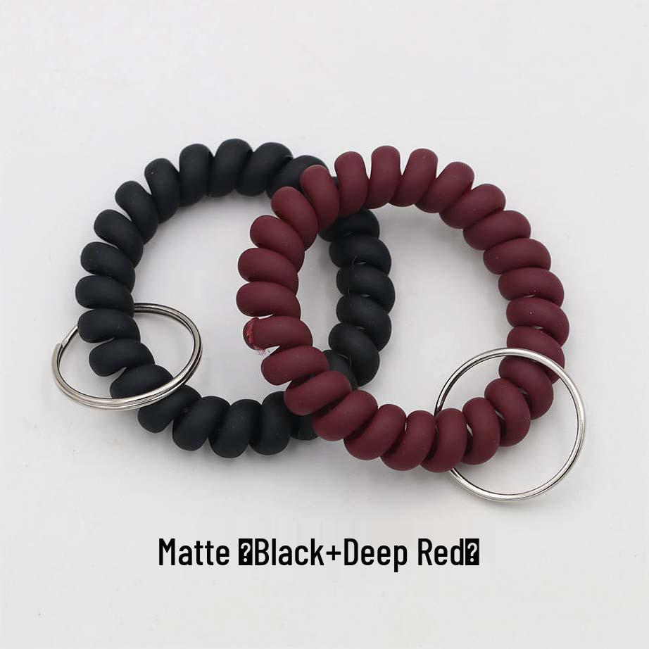 Минималистичный браслет-брелок и резинка для волос в виде пружинного механизма