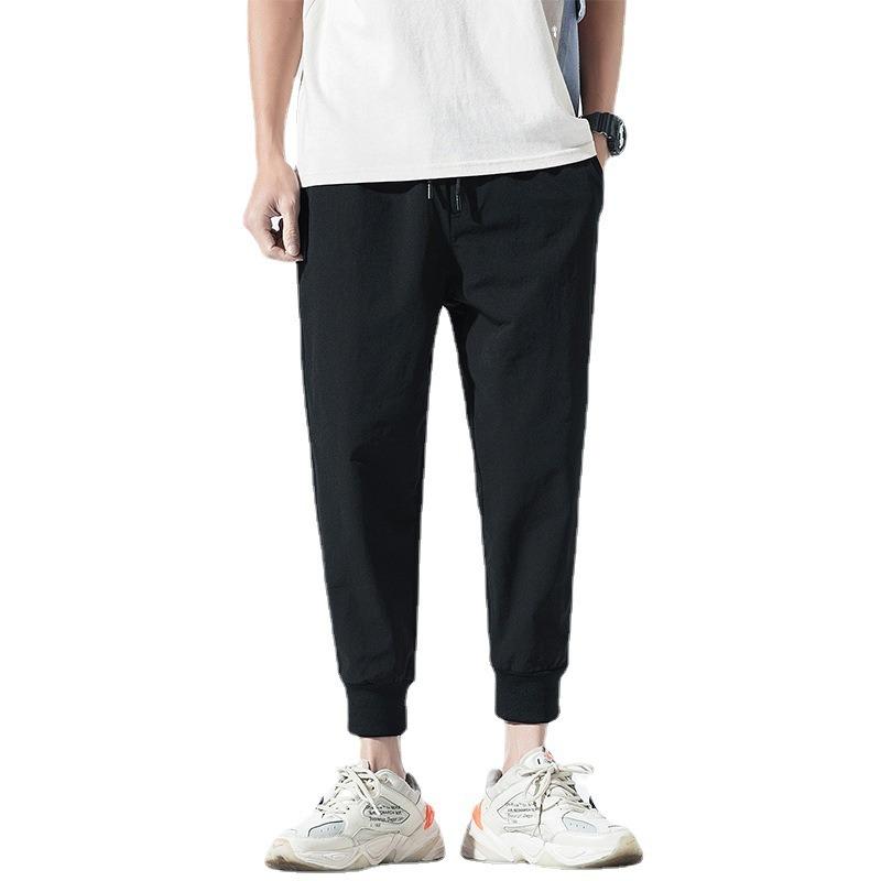 Повседневные брюки мужские летне-осенний тренд зауженные большого размера показывающие рост свободные жир однотонные спортивные на резинке девятиточечные брюки универсальные