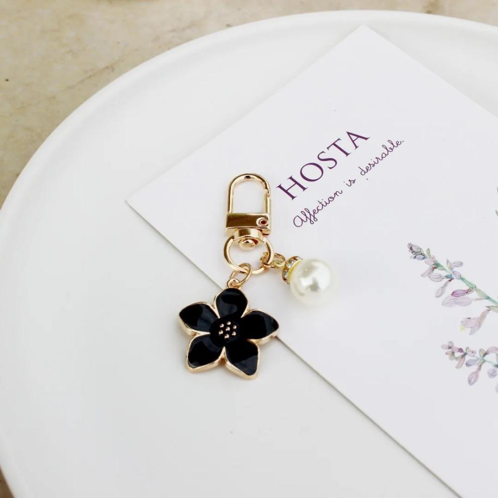 Новый очаровательный брелок в виде цветка сакуры с жемчужной подвеской и эмалью, украшение для женской сумки, брелок для ключей, аксессуар для автомобильных ключей.