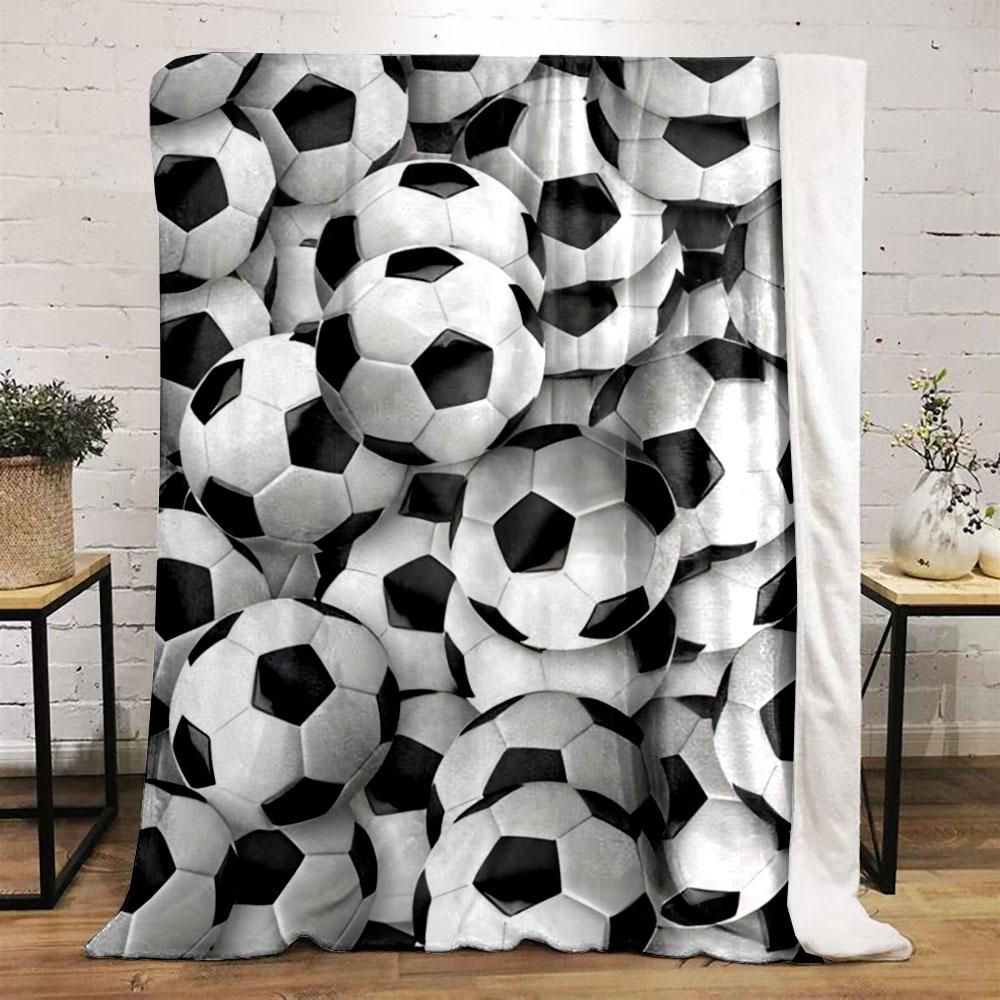 The main pattern is a dense arrangement of black-and-white soccer balls. for all seasons blanket lunch break throw gift