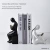 Figure Bookends with Decorative Books