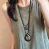Bohemian Ethnic Distressed Bow Metal Necklace with Versatile Long Round Pendant 2025