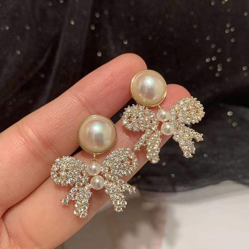 Temperamental Women's Hollow Out Bowknot Zirconia Earrings Dangling Ladies Pearl Earrings Exquisite Generous Ear Jewelry
