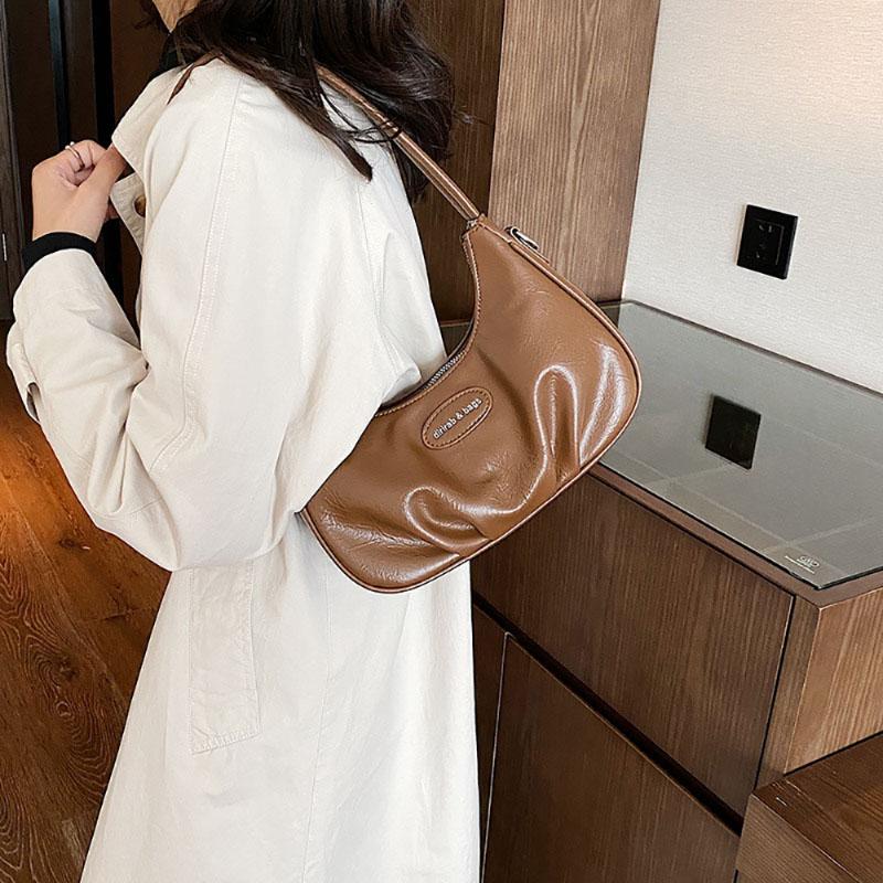 Корейская версия подмышечная сумка складная искусственная кожа однотонная женская сумка нишевый дизайн чувственная текстура одно плечо сумка простая новая