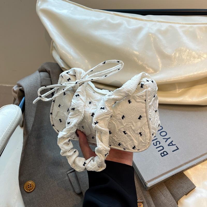 Beautiful foreign style bow one shoulder armpit bag women's summer new high value crescent bag pleated handbag