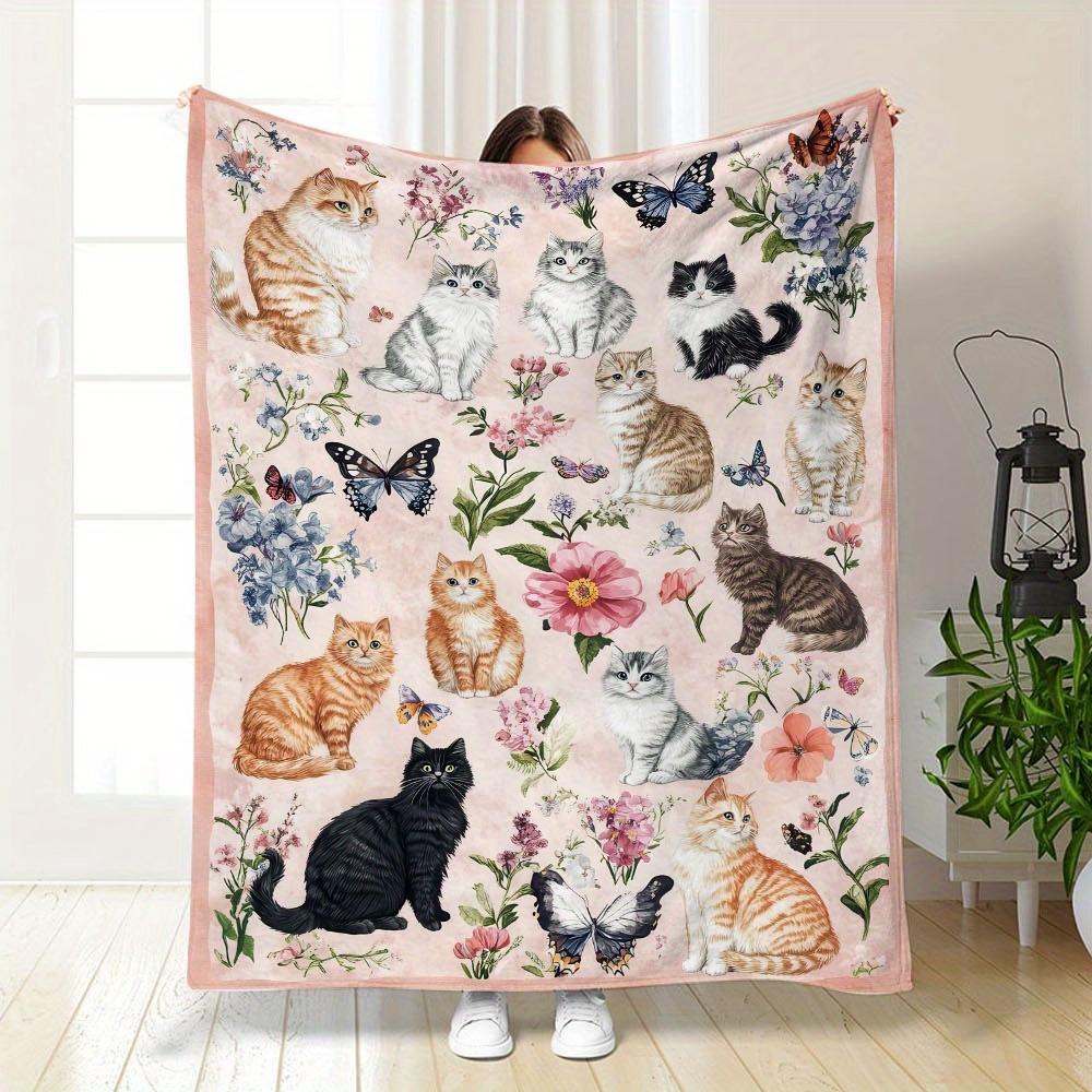 A Single Cozy And Soft Fleece Throw Blanket Featuring Adorable Cats And a Floral Pattern, Ideal for Use on a Couch, Sofa, Bed, Or in The Liv