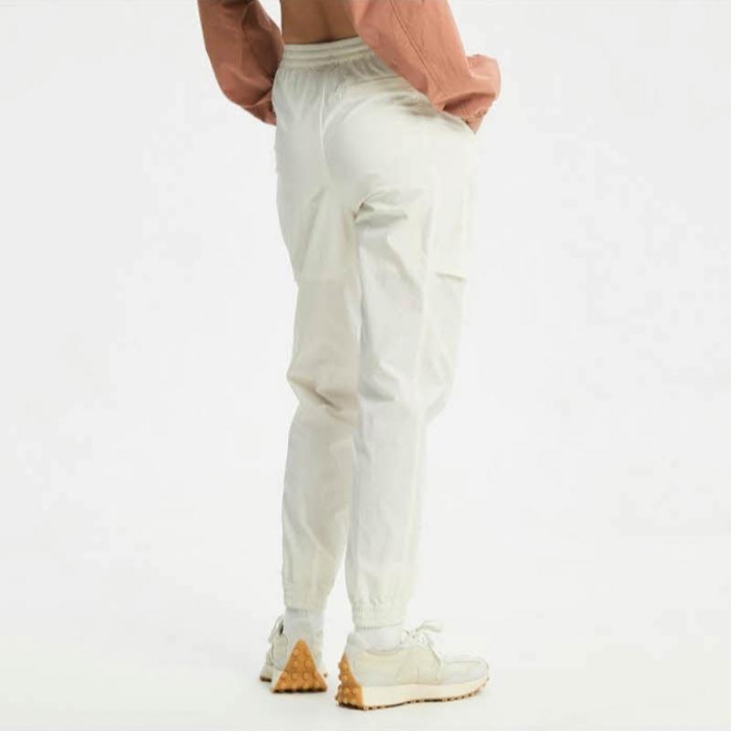 New Balance Брюки Eqs Nbnte2w412 64 женские нейлоновые эластичные брюки-джоггеры