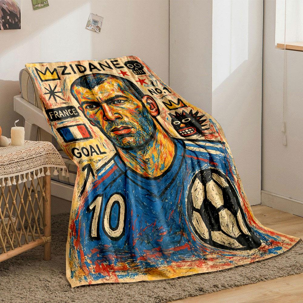 The pattern includes symbols, text, and soccer-themed imagery with bold colors. for all seasons blanket lunch break throw gift