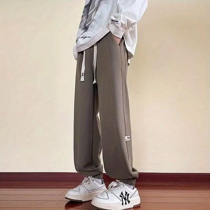 Весенние и летние свободные брюки для мужского гардероба. Дизайн брюк. Модные спортивные универсальные и красивые повседневные брюки.