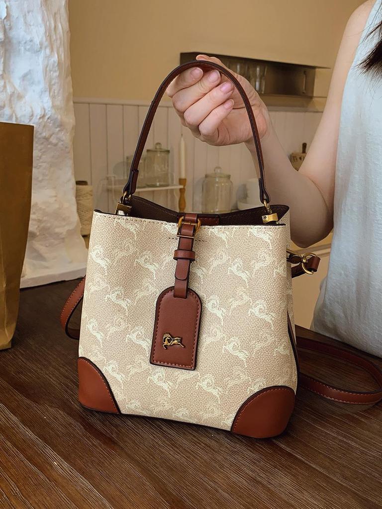 Трендовая сумка-тоут для通勤 2025: Модная сумка-ведро через плечо и на плечо