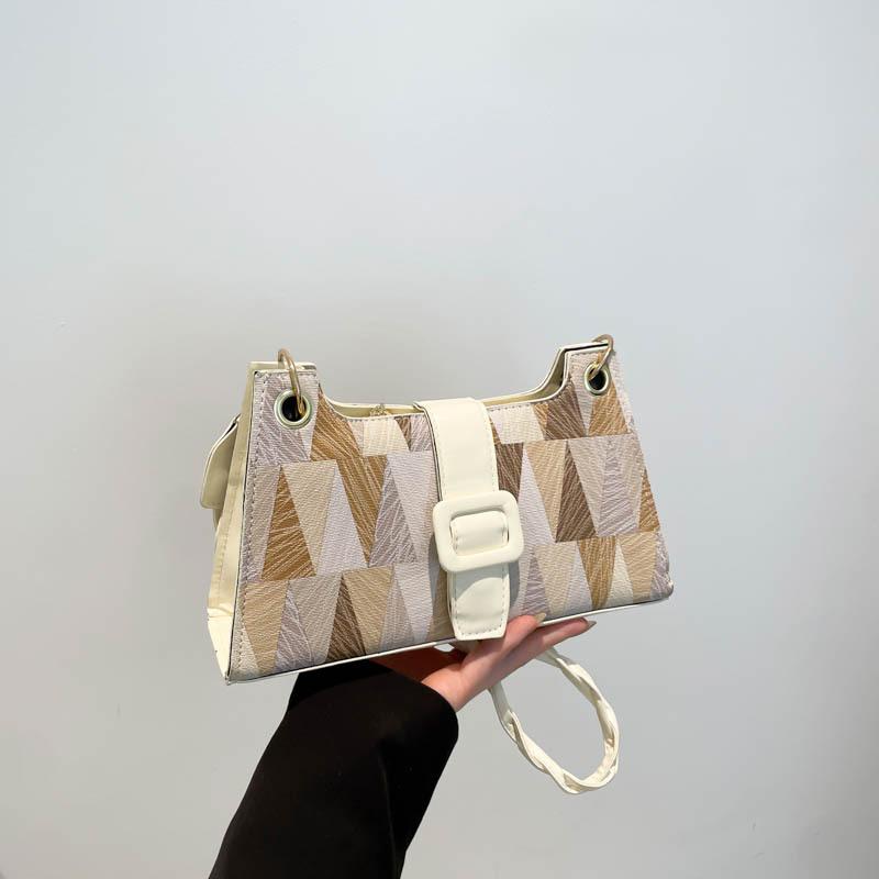 Маленькая сумка высокого класса, женская весна 2025, новая модель, популярный нишевый дизайн этого года, сумка на плечо/подмышку, универсальная сумка-мессенджер