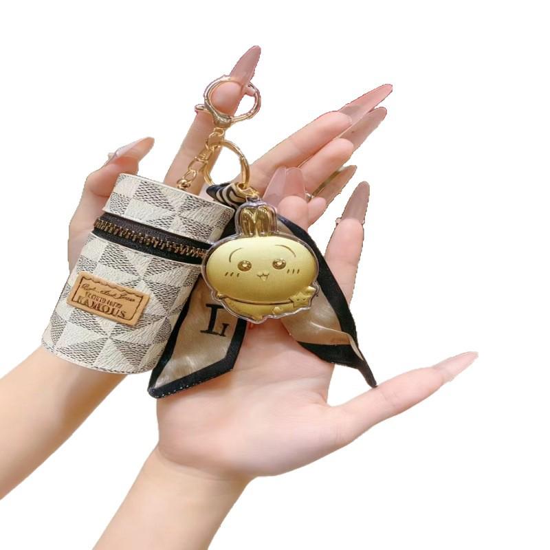 Золотой брелок Cinnamoroll и кожаная сумка для телефона с монограммой и высококачественным подвесом-шармом