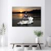 Canvas print, Buddha on a background of a setting sun