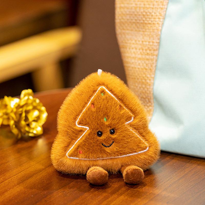 Рождественское праздничное украшение: Плюшевое дерево, Яблочный венок мира и Декоративная подушка в виде пряничного человечка.