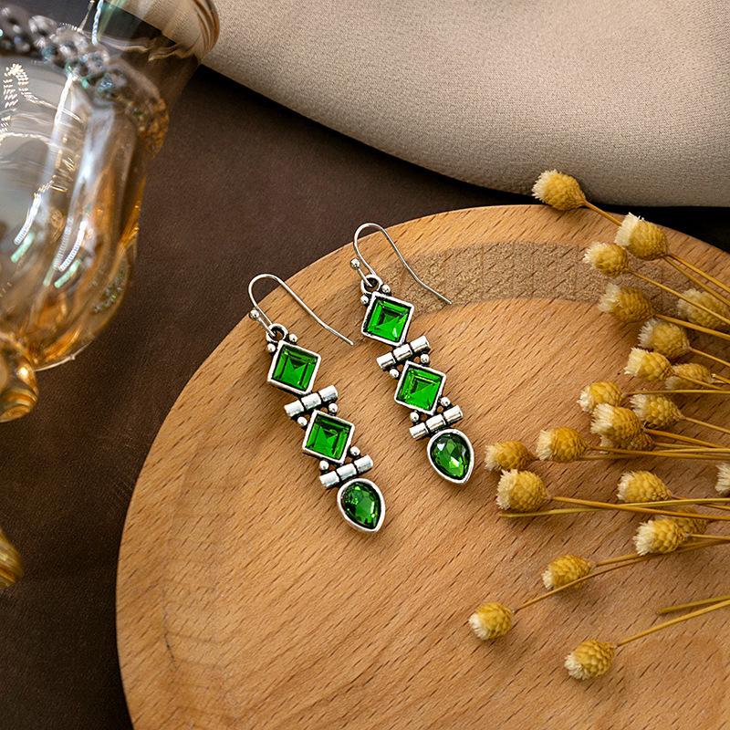 "European & American Retro Turquoise Feather Earrings: Bohemian Dragonfly, Bird, Water Drop, Round, & Pearl Designs"