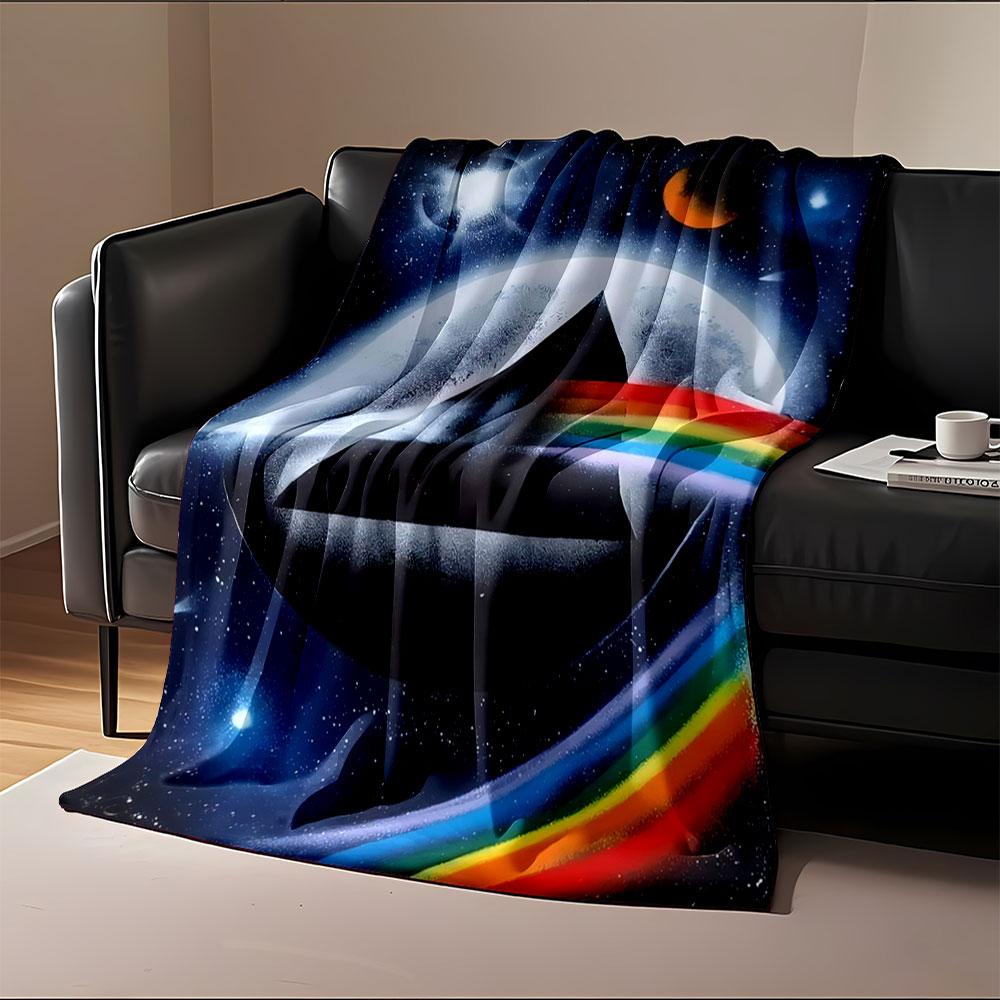 A black triangle with a rainbow beam amidst a cosmic space background. for all seasons blanket lunch break throw gift