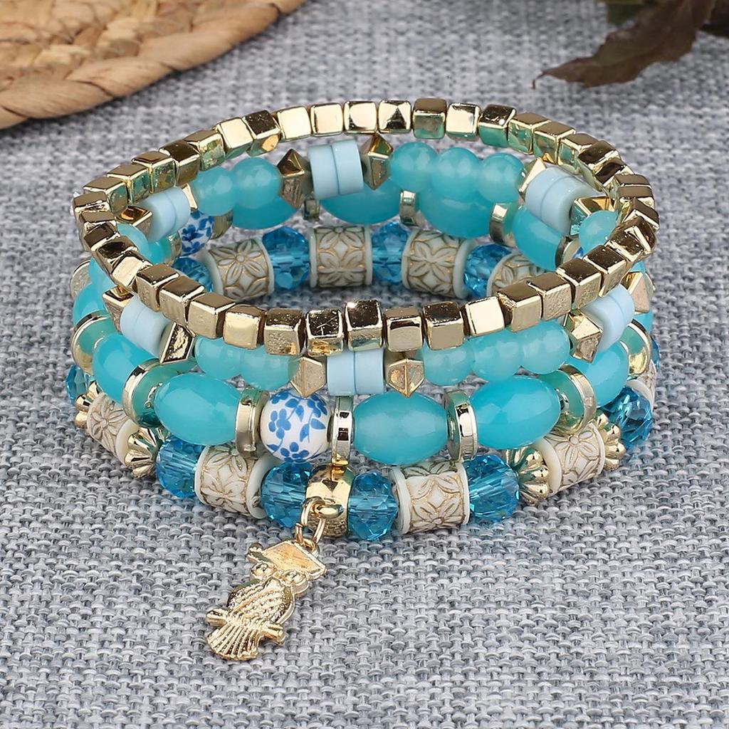 Богемный многослойный браслет с бусинами и подвеской-совой