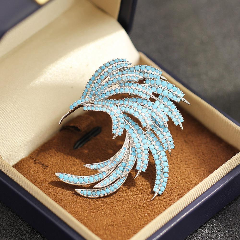 New high-end blue zircon inlaid stone phoenix feather brooch niche light luxury anti-light pin accessories women's models