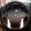 Для Toyota Land Cruiser Prado 2010-2017 Ручная прошивка Нескользящая Черная кожа Отделка под персиковое дерево Чехол на руль автомобиля