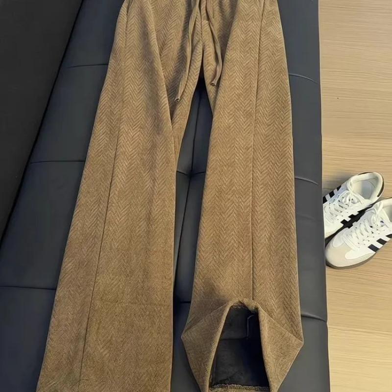 Женские расклешенные брюки в елочку с высокой талией и разрезом по низу, узкого кроя