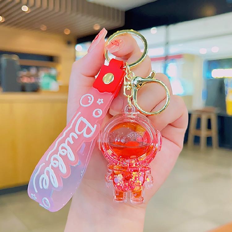 Модный брелок с милыми мультяшными куклами и пересыпающимся песком в прочной смоле с масляной подвеской для повседневного использования и повседневной носки