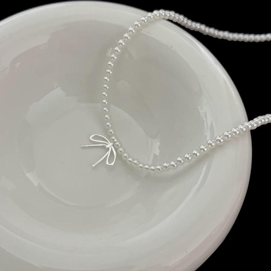 Ожерелье с подвеской в виде банта из жемчуга, женская легкая роскошная нишевая цепочка для темперамента на шею, новая цепочка на ключицу