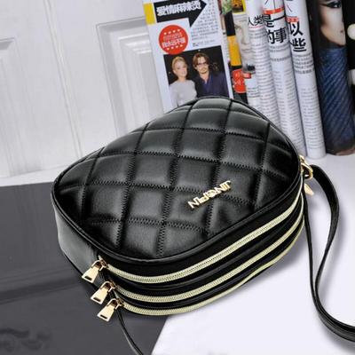 Женская сумочка на ремне через плечо