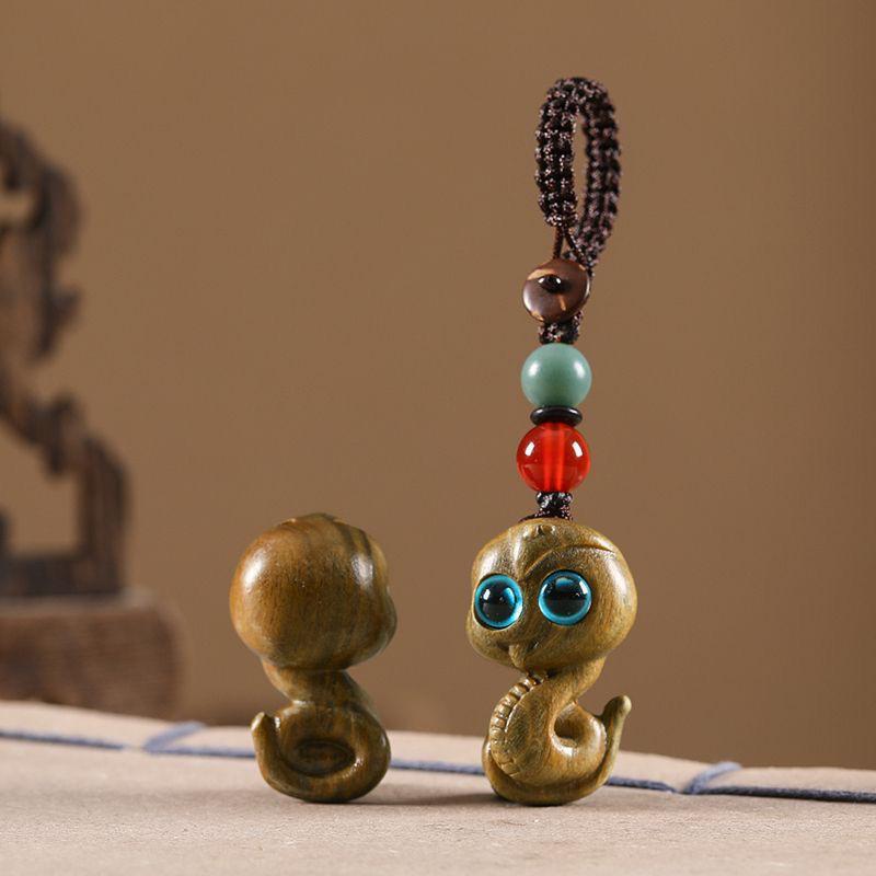 Twelve Zodiac Animal Charms Green Sandalwood Set: Rat, Ox, Tiger, Rabbit, Dragon, Snake, Horse, Sheep, Monkey, Rooster, Dog, Pig.