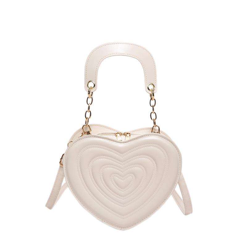 Сумка с углублениями 2024 года, новая модная сумка в форме сердца, милая модная сумка через плечо, однотонная сумка в форме сердца для девочек