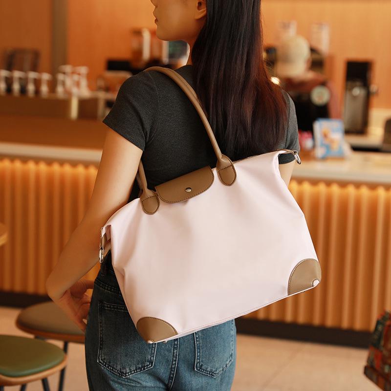 Simple Casual Women's Dumpling Handbag: High-End, Large Capacity, Crossbody & Commute Bag