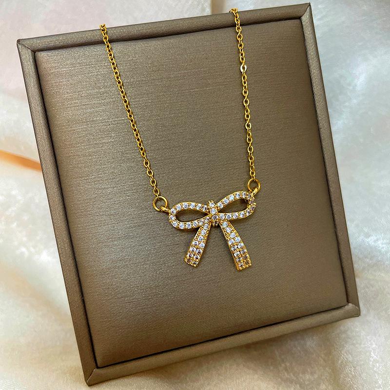 Позолоченная медь 18 карат, цепочка на ключицу с дизайном абака, тыквы-горлянки и лебедя.