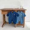 Baby Romper: Soft Denim, Turn-Down Collar, Snap Closure, Stylish Jumpsuit for 0-2 Years, Perfect for Spring & Autumn.