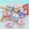 Modern Cotton Linen Handheld Bag For Girls Featuring Trendy Bow And Pearl Embellishments