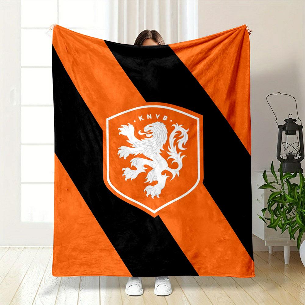 Diagonal black stripes on an orange background with a lion crest. for all seasons blanket lunch break throw gift