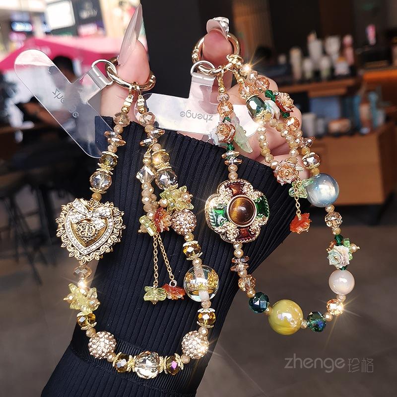 Light luxury mobile phone chain pendant women's high-value boutique handmade beaded wrist rope short outdoor travel