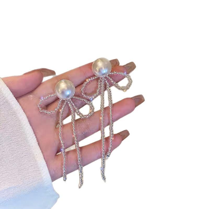 New temperament fringed bow earrings female, niche design handmade pearl Internet celebrity earrings earrings