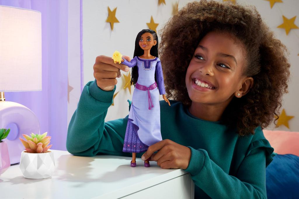 Polly Pocket Mattel Disney Wish Toy: Asha of Rosas Sings Fashion Doll & Star Figure. Features removable clothing for posing and sings "This Wish" in E