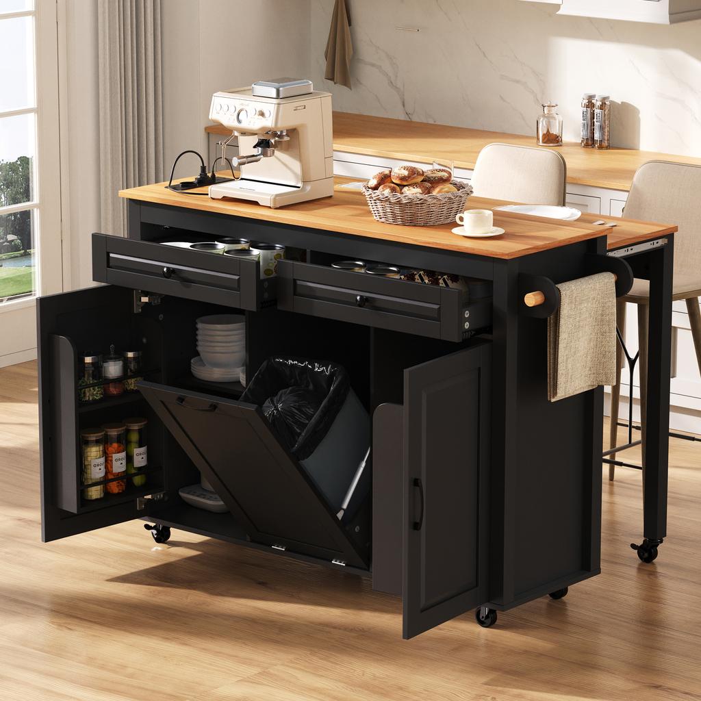 Kitchen island on casters, pull-out dining area with worktop and waste bin compartment, with power sockets (Black)