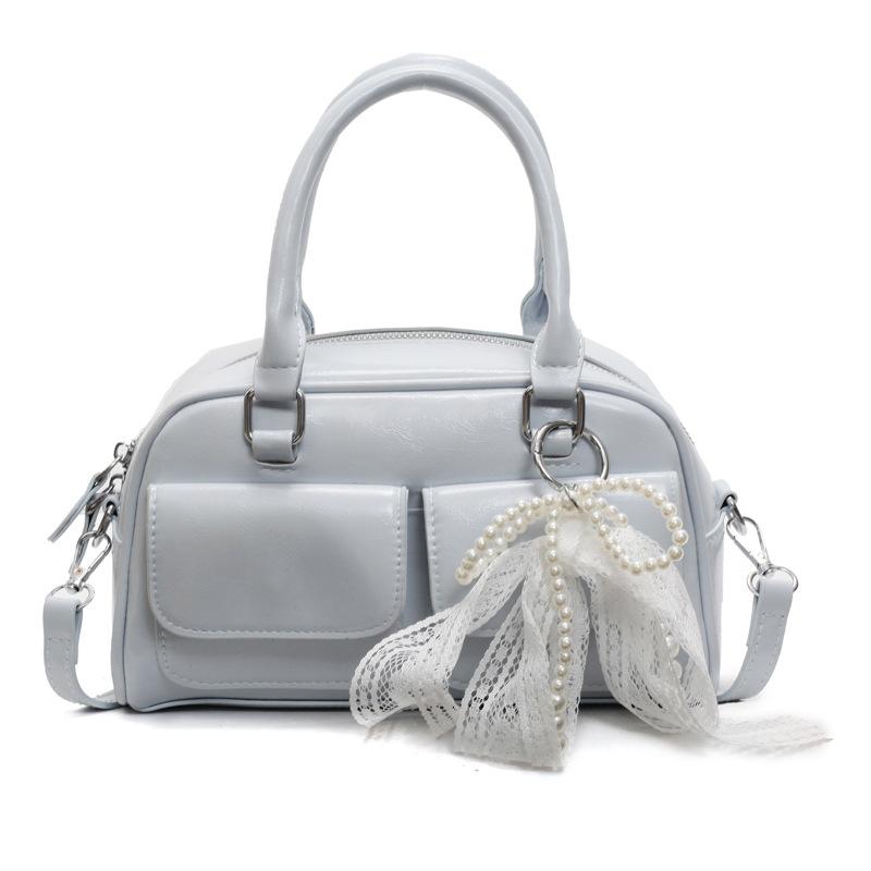 Корейская версия популярной весенне-летней дофаминовой простой портативной сумки-бостонки, нишевая повседневная сумка-мессенджер в иностранном стиле для通勤, женская