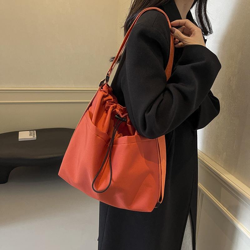 2024 New Japanese Solid Color One Shoulder Underarm Bag Folded Simple Drawstring Lightweight Casual Commuter Double Shoulder Bucket Bag