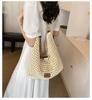 Woven hollow bag women's 2025 new spring and summer seaside vacation travel tote bag beach bag shoulder armpit bag